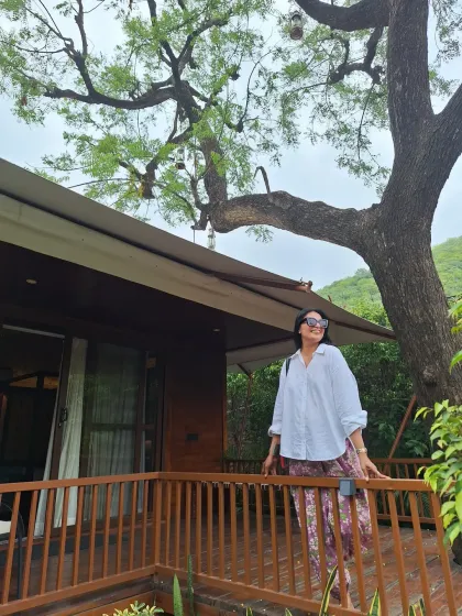 Rejuvenating in serenity. A simple white shirt and printed pants are a comfortable and chic outfit for a relaxing day at a spa resort.