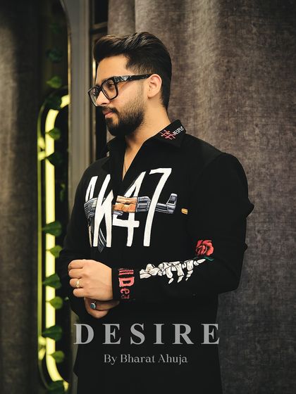 A masterpiece of tailoring. This AK-47 shirt features intricate, hand-painted details and embroidery, blending rebellious art with refined luxury.