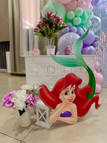No Little Mermaid party is complete without Ariel! This life-sized cutout adds a perfect touch of Disney magic to the underwater scene.