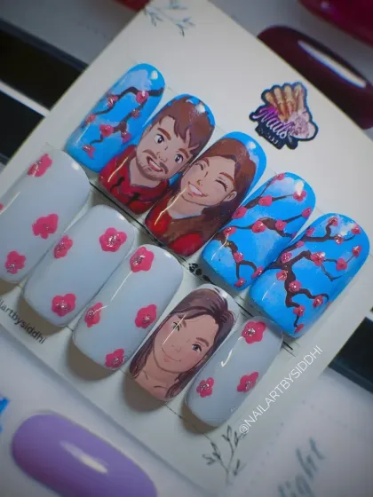 This shows a completed custom set inspired by the Ghibli art trend, featuring hand-painted character portraits and floral details. You can see how the press-on nails are presented and packaged before I ship them to you.