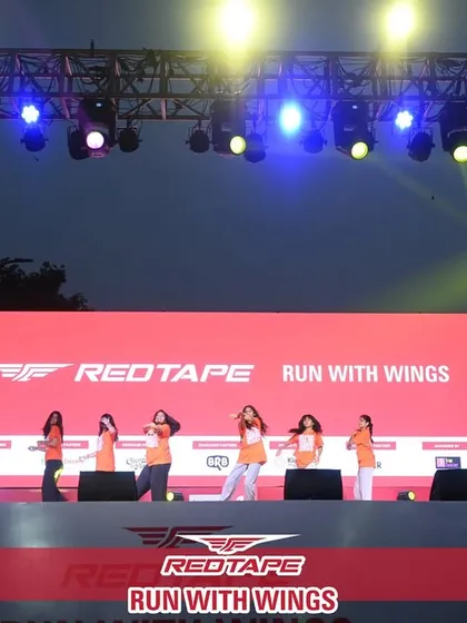 A race is also a celebration. I incorporate entertainment and engagement, like this professional dance performance on the main stage, to create a complete festival atmosphere that keeps the energy high for participants and spectators.