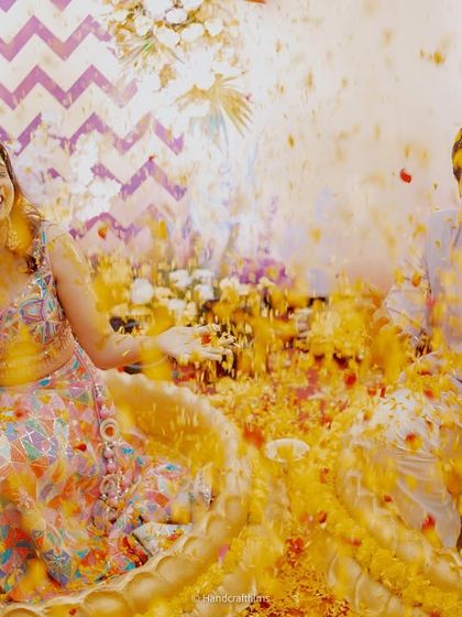 The pure joy of a Haldi ceremony! My bride Shweta and her groom are covered in turmeric and flower petals, and her makeup stays put.