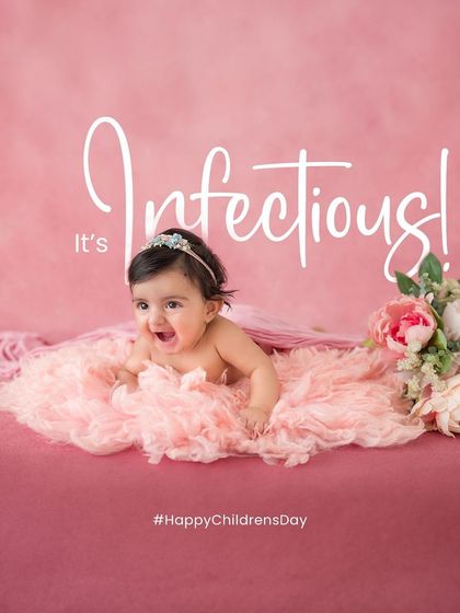 An infectious smile. This baby's joyful expression is simply contagious. Her happy face and cute pose make for a perfect milestone portrait.