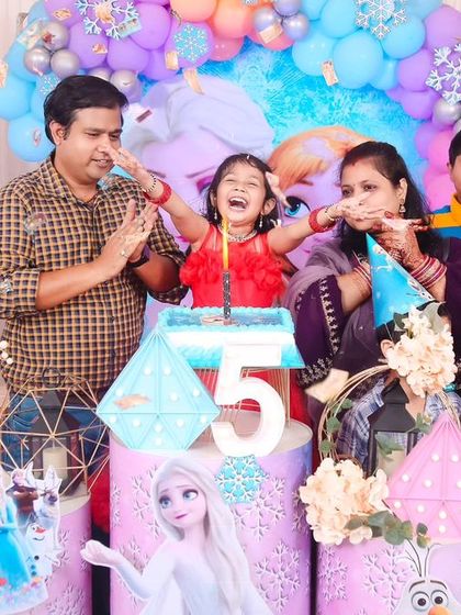 A playful 'CoComelon' themed birthday party, with bright colors, character cutouts, and a fun balloon arch, creating a joyful atmosphere for little ones.