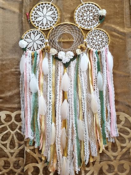 A touch of gold dust for your walls. This custom cluster dreamcatcher, personalized with the name 'Anindita', features soft pastel and gold tones for a truly magical feel.