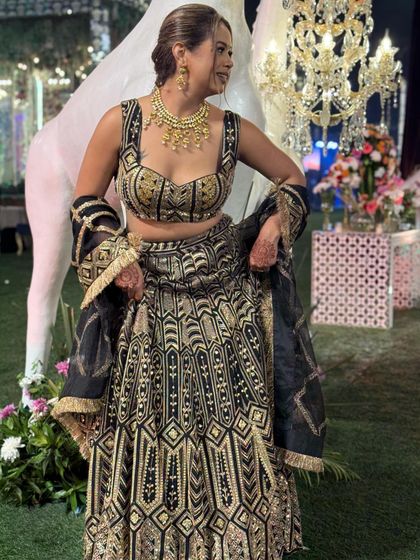 This has to be one of the best looks ever created for me. The intricate black and gold lehenga, paired with a stunning necklace and braided hairstyle, was perfect for a royal-themed wedding.