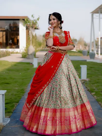 I collaborate with designers to create stunning lookbook images. This full-length shot showcases a beautiful traditional lehenga, capturing the flow of the fabric and the intricate details of the design in a natural outdoor setting.