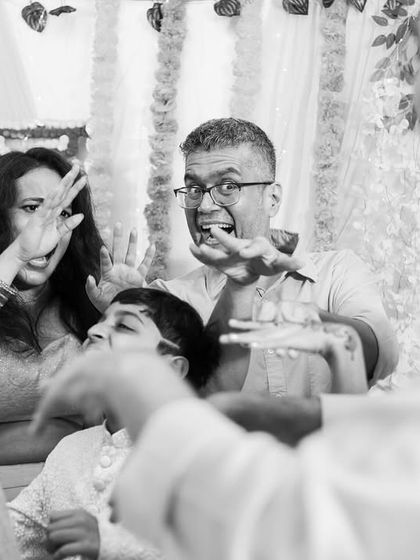 A fun, candid black and white shot of guests enjoying the Sangeet.