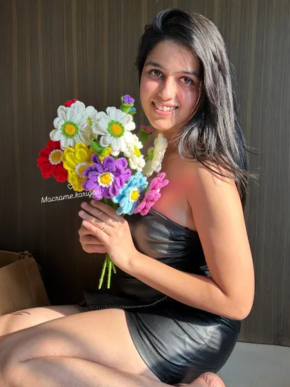 Holding a bouquet of our colorful Zianna crochet flowers always brings a smile to my face. These everlasting blooms are handmade with love and are perfect for gifting or brightening up your own space.