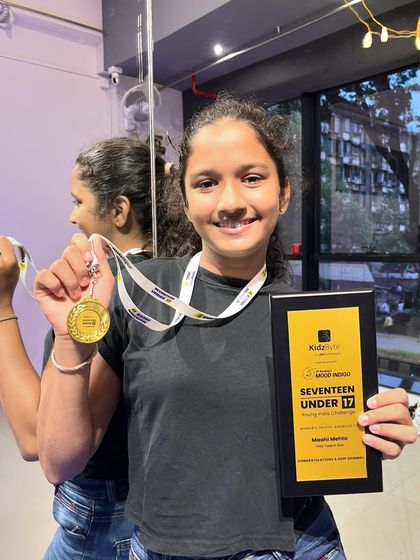 A close-up of the medal and plaque won by our student. Hard work and dedication always pay off.