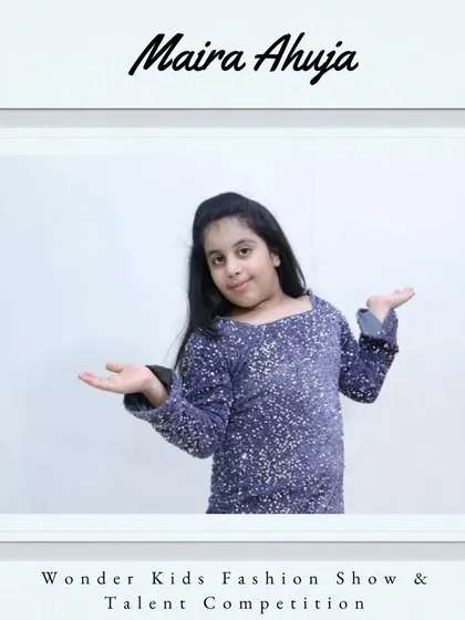 Welcome aboard, Maira Ahuja. Her sparkling top and welcoming pose say she's ready for the spotlight.