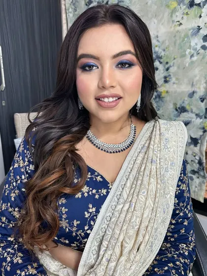 A direct look at this stunning blue smokey eye. I carefully blended multiple shades of blue and black to create this depth and dimension, making her eyes the center of attention.