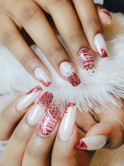 Another angle of the festive red glitter and white nail art, perfect for the holidays or any celebration.
