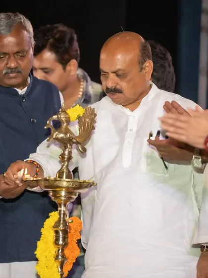 The traditional lamp lighting ceremony to inaugurate the event, featuring former Chief Minister Basavaraj Bommai. We understand the cultural significance of these moments and capture them respectfully and professionally.