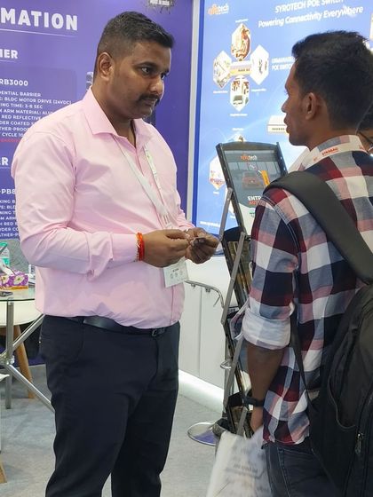 One-on-one interactions are key. Here, a team member provides detailed information to an attendee at Traffic Infratech 2024.