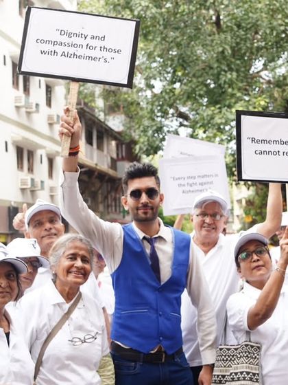 Holding up signs to "Remember those who cannot remember." Every step and every voice counts in the fight for awareness.