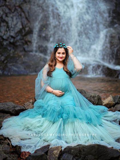 Our Winter gown looks spectacular in nature. The cool blue tones of the dress create a beautiful contrast against the natural backdrop of a waterfall.