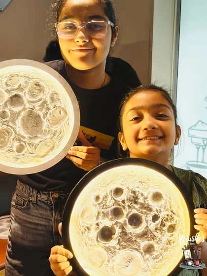Sisters showing off their glowing creations. A fun and unique activity for siblings to do together for a special occasion or just for fun.
