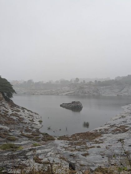 The misty, moody landscape of a quarry lake on a foggy morning. Our rides take you to some surprisingly beautiful and dramatic locations around Bangalore.