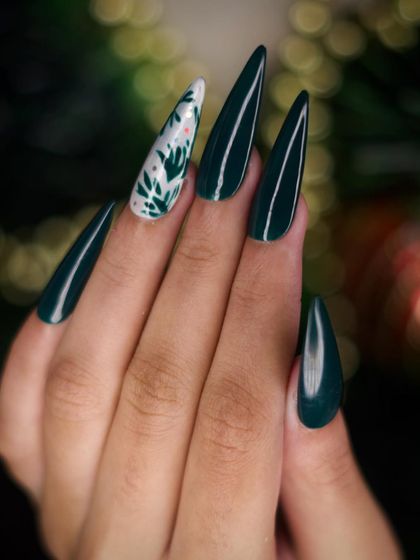 A clear, focused shot of the green foliage nail art. The fine lines of the leaves are clearly visible, showcasing the detailed brushwork involved in creating this custom design.
