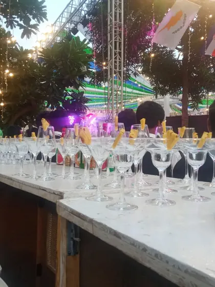An elegant mocktail bar setup with martini glasses ready for service at a large corporate function. I can create a bar experience that matches the theme of your event.