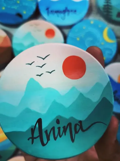 A duplicate of 64, this "Anina" magnet features a beautiful mountain range at sunrise, with birds flying in the distance. The blended colors create a serene landscape.