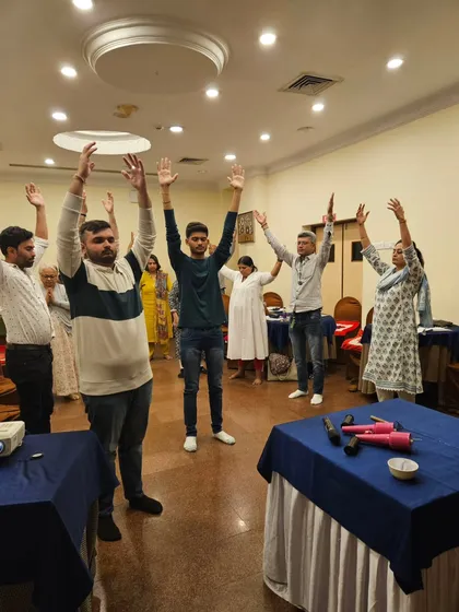 A group energy-raising exercise to conclude the Aura & Chakra workshop, leaving everyone feeling refreshed and positive.