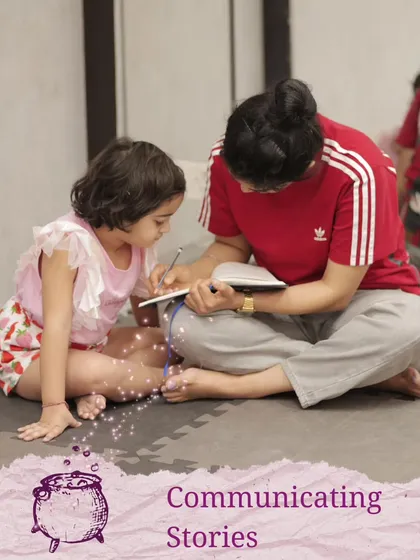 Communicating stories is at the heart of what we do. Here, a facilitator helps a young child write down her ideas, valuing her contribution to the script.