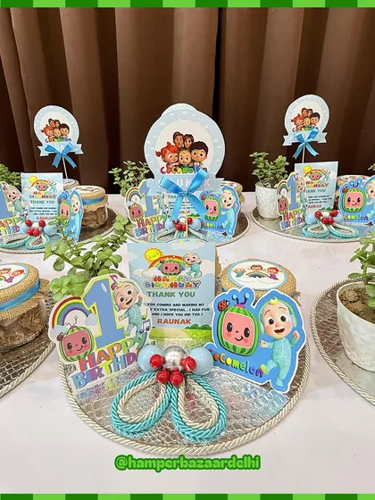 These Cocomelon hampers are arranged on silver trays, making for a beautiful and budget-friendly return gift option.