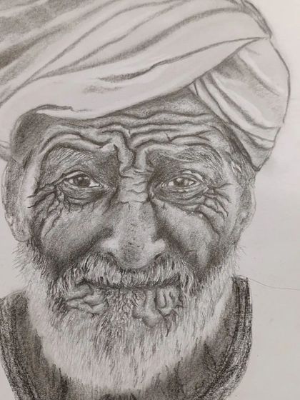 Further progress on the same portrait, where the beard and clothing are beginning to take shape. This demonstrates how we work on different elements of the portrait in stages.