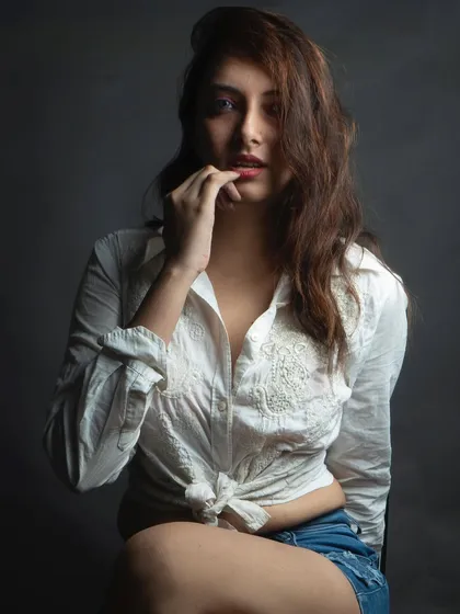 A close-up portrait with a more introspective and subtle expression. This type of shot adds emotional depth and range to a model's book.