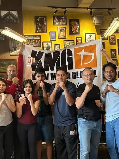 The group at our Dadar Social seminar, holding the KMG banner. These events are a great introduction to the principles of Krav Maga in a fun, high-energy environment.
