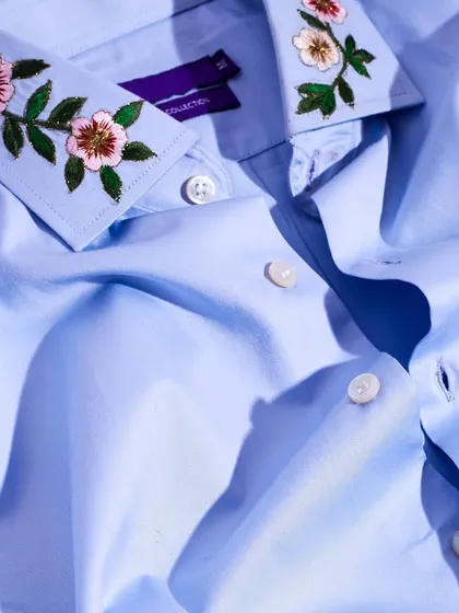 Another view of the floral embroidered collar, showing the fine stitching and subtle color variations that bring the design to life.