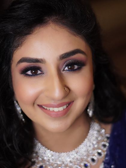 Aditi's reception look was all about a touch of drama. The glittery, smokey eye was enhanced with a pop of blue eyeliner along the lash line, adding a unique and modern twist to her glamorous look.