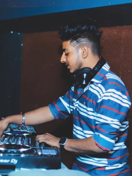 Back to basics. A side profile of me working the Pioneer DJ setup, a familiar sight for anyone who has seen me perform at a club or private event.