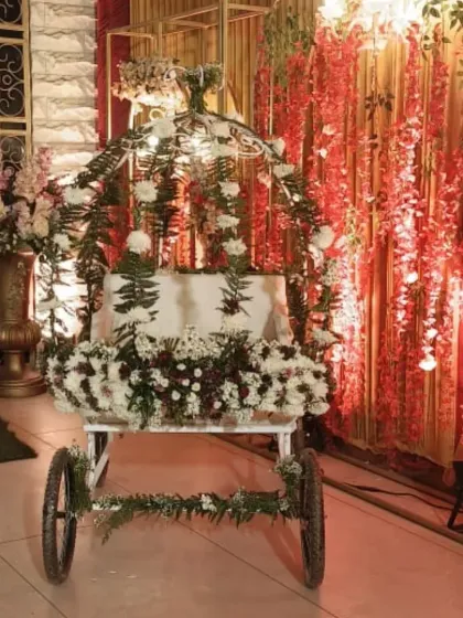 I believe the birthday star deserves a grand entrance. This is one of my custom decorated royal carts, adorned with fresh flowers and foliage, ready to make a child's 5th birthday entry feel like a fairytale moment.