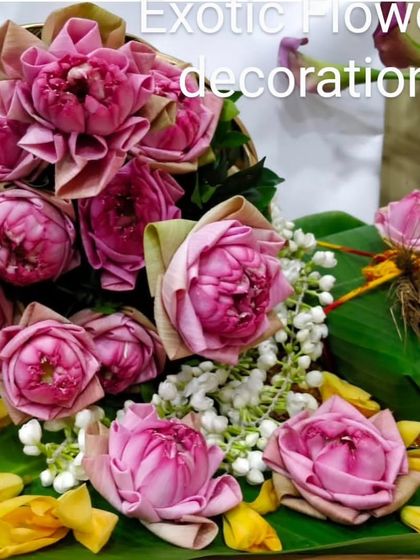 A close-up of beautifully folded pink lotus buds, ready to be used in a sacred arrangement. The lotus is a symbol of purity and divinity, and we prepare each one with utmost care.