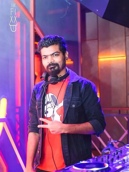 Posing for a quick shot at The Fixx Bar. Even when the party is raging, I'm focused on delivering the best musical experience.