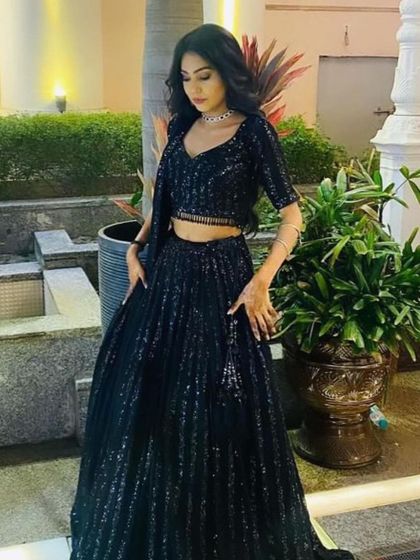 This rental lehenga is all about the sparkle. The vertical sequin stripes create a flattering and elongating effect.