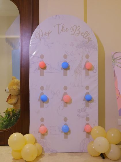 A playful "Pop the Belly" game for the baby shower. Guests can pop a pink or blue balloon in this fun take on a gender reveal or just as a simple party game.