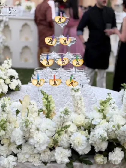 For moments that call for pure elegance, our champagne towers are a classic choice. We meticulously arrange each tower, often surrounded by beautiful floral decor, to create a stunning centerpiece for toasts and celebrations at luxury weddings.