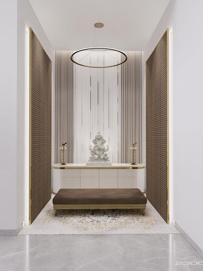 A serene prayer room (puja space) designed for the Meraki project. A calm, neutral palette, a modern circular light fixture, and textured side panels create a peaceful and contemplative atmosphere centered around a beautiful Ganesha idol.