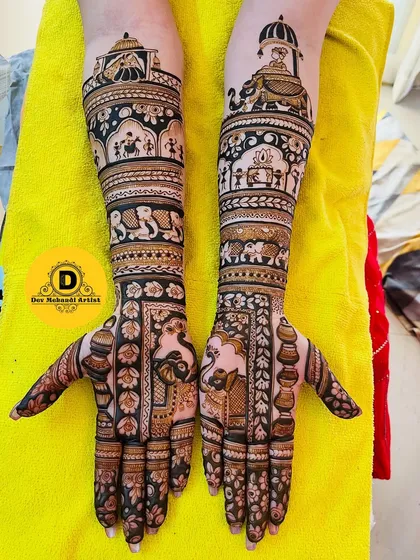 A complete bridal mehndi that tells a royal story. This design includes intricate details like a baraat procession with elephants, palace architecture, and traditional motifs, covering the hands and arms beautifully.