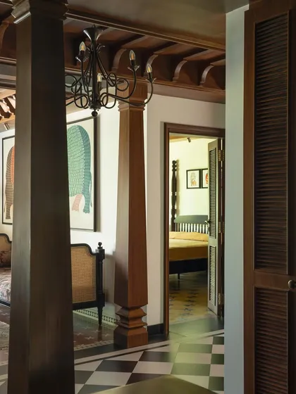 A view from the living area towards the bedroom, showing the continuity of the traditional architectural elements.