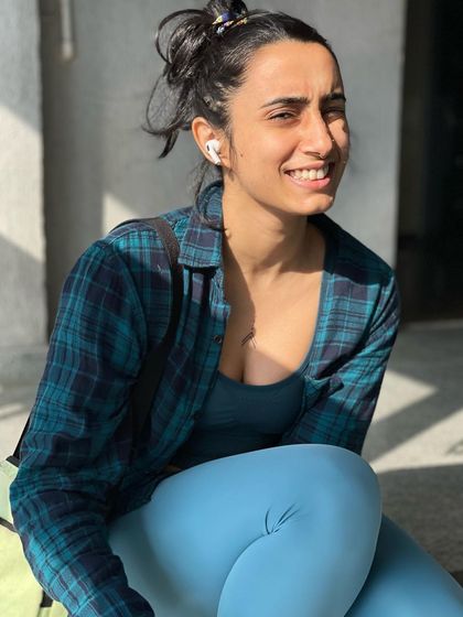 A warm, genuine smile captured in a candid moment.