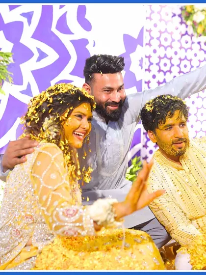 The couple posing with a friend amidst the Haldi celebrations. It's all about sharing the happiness with your loved ones.