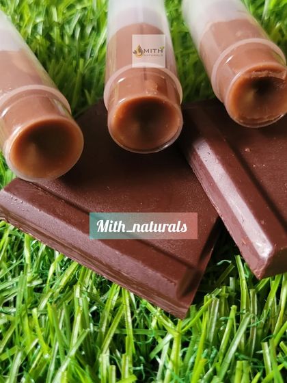 My homemade chocolate lip balm looks good enough to eat. It's made with cocoa butter and vitamin E to give your lips long-lasting hydration and nourishment.