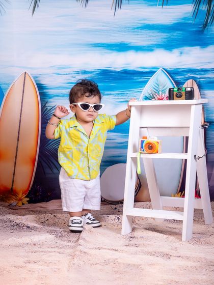Chillin' like a little island boss. The "Surf's Up" beach theme, complete with surfboards and cool shades, is perfect for a laid-back and fun-loving child.
