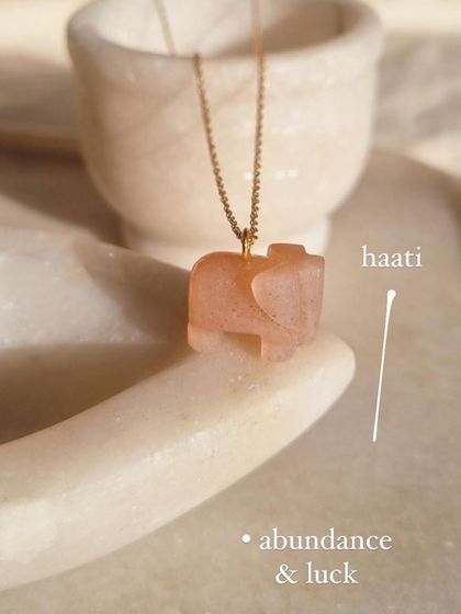 Unlucky in love? Wear Peach Moonstone. This 'haati' elephant pendant is a symbol of abundance and luck.