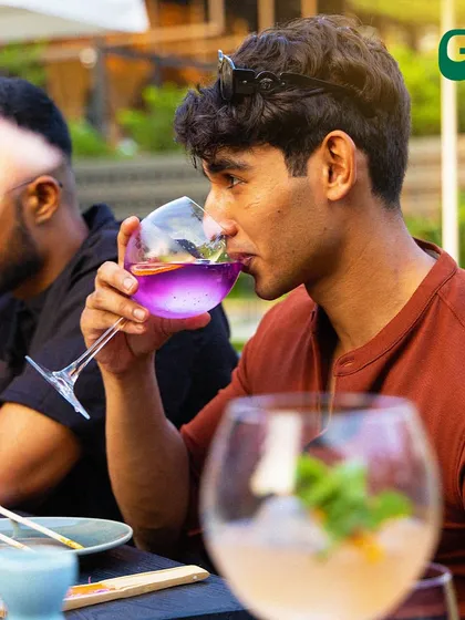 Just a guy, his cocktail, and all the good vibes. Whether you're here with friends or flying solo, it's a place to relax and enjoy the moment.
